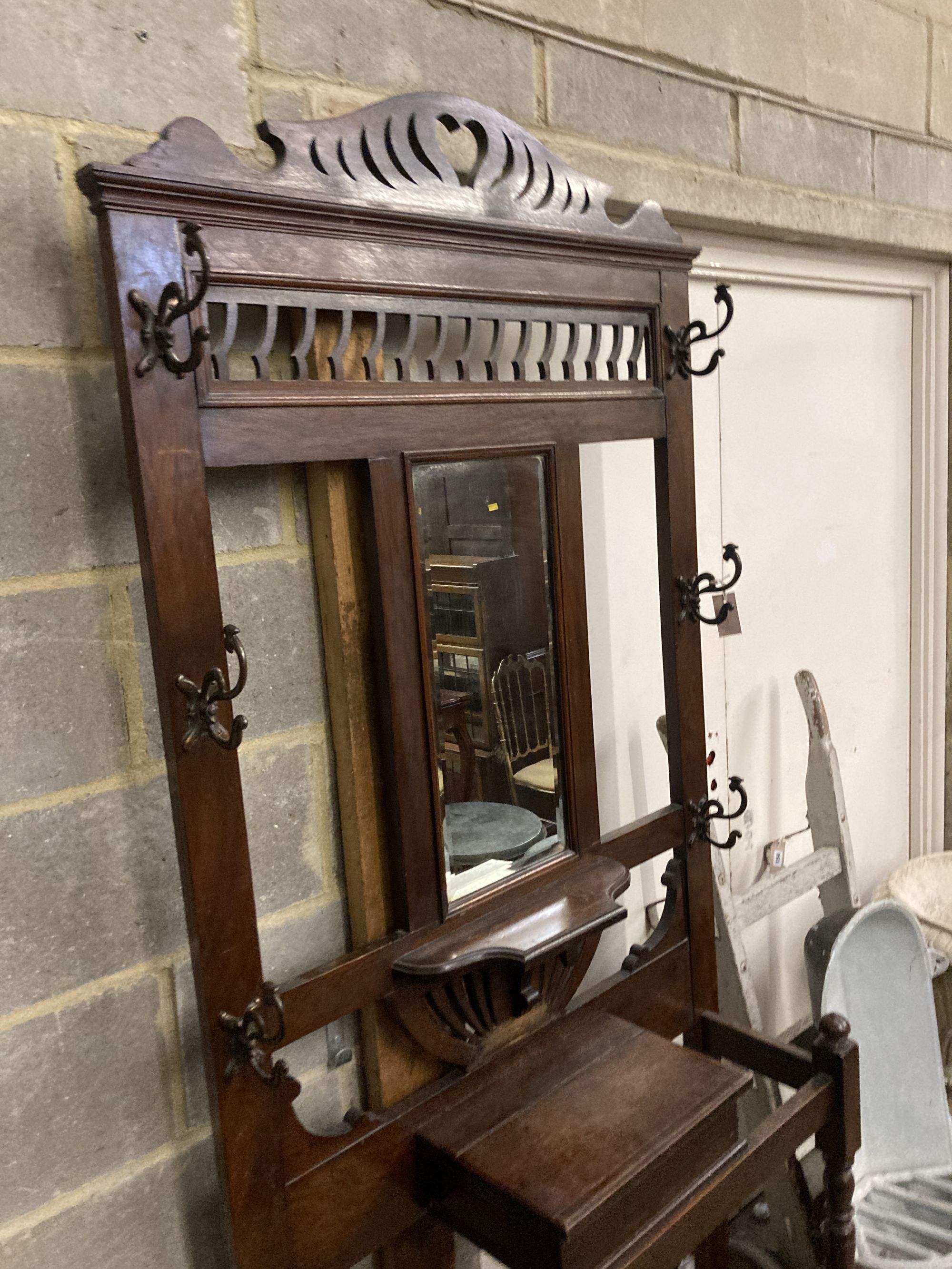 A late Victorian mahogany hallstand, width 93cm, depth 29cm, height 210cm